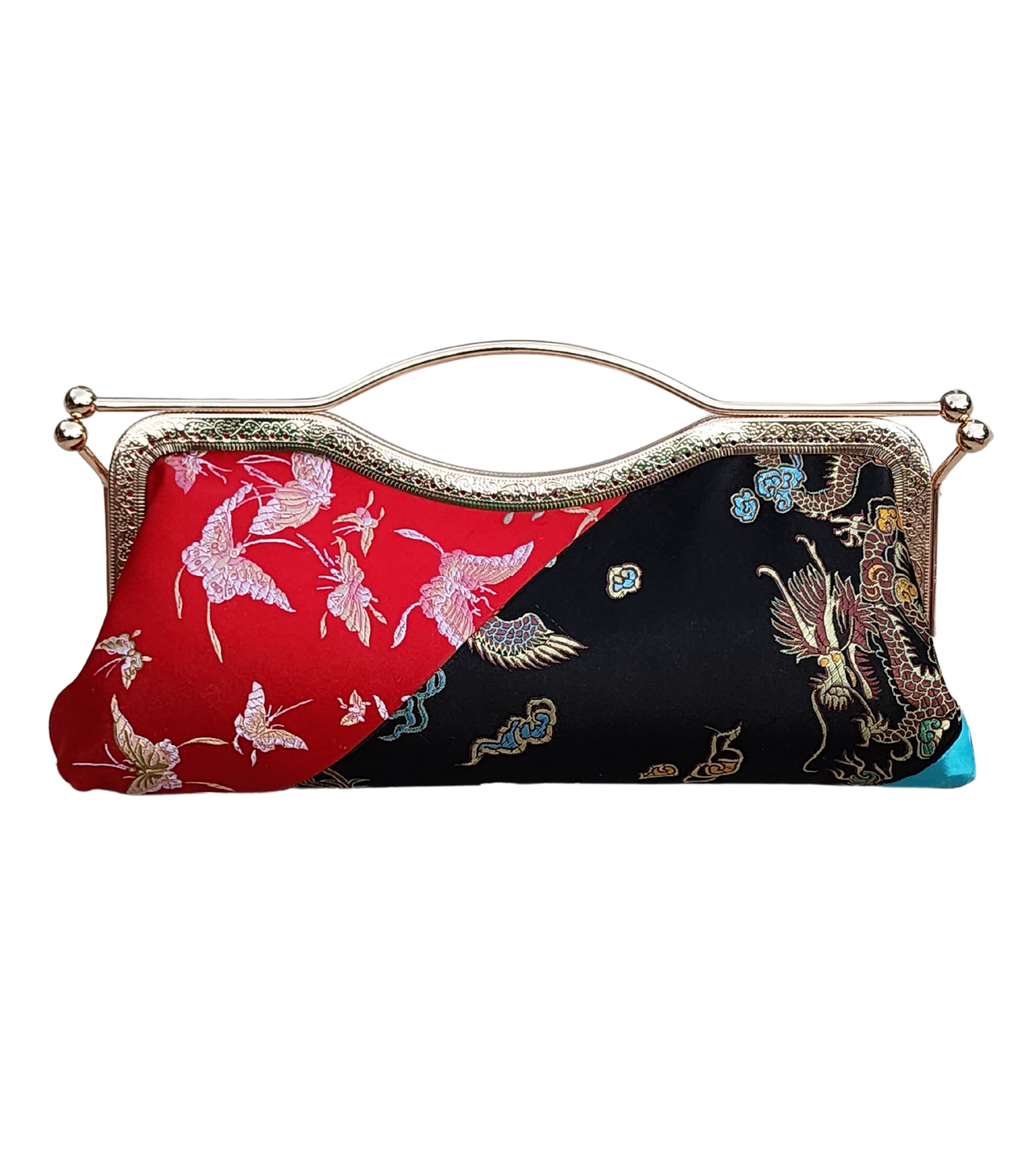 Tranquil Fusion bold brocade clutch by Nola & Eve in red, black, and turquoise with crossbody chain