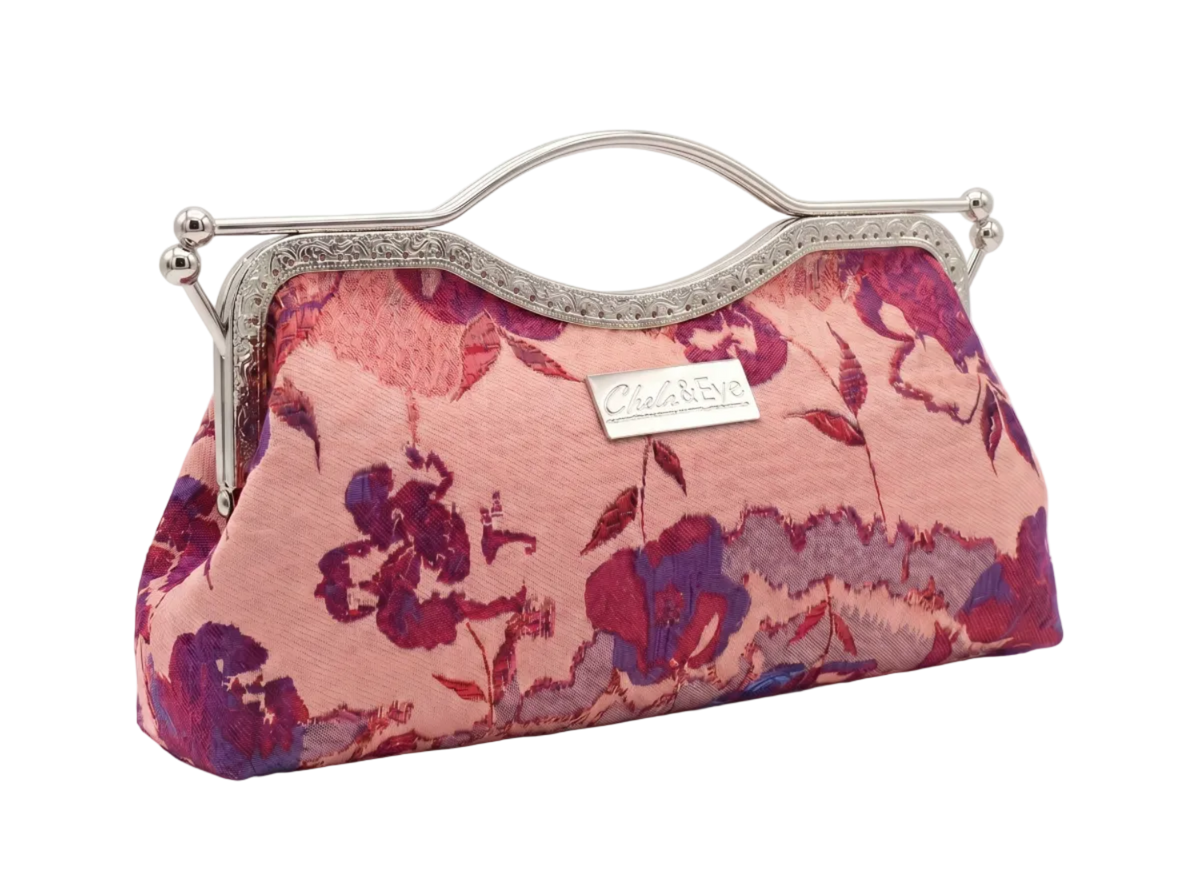 Nola & Eve Blossom Veil Classic Contemporary floral brocade clutch in side view with silver kiss-lock frame and thin metallic strap, limited-edition statement bag