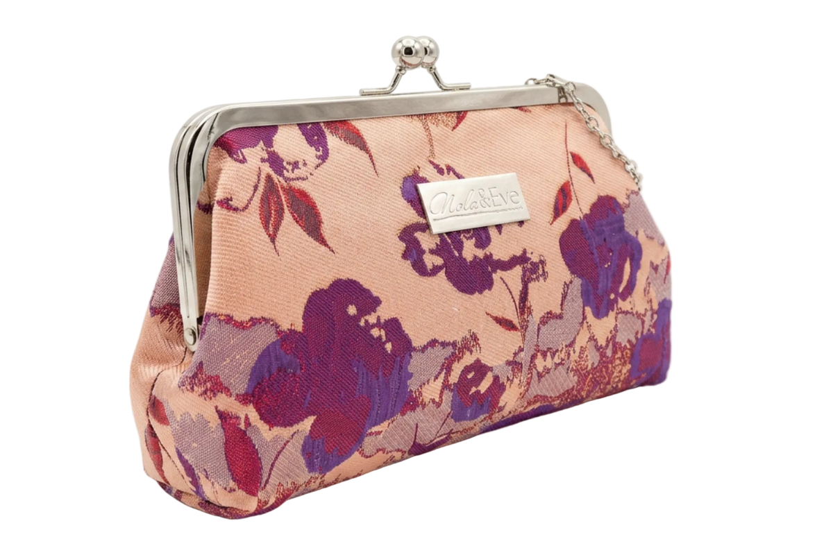 Nola & Eve Blossom Veil Classic Large floral brocade clutch in side view with silver kiss-lock frame and thin metallic strap, limited-edition statement bag