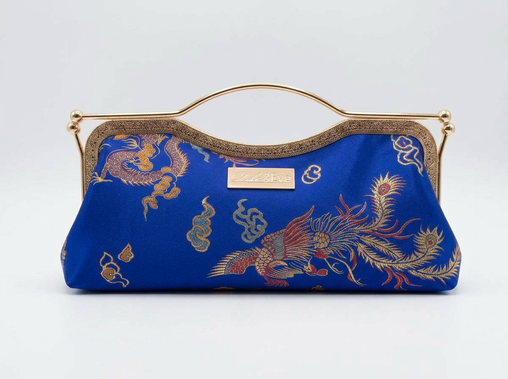 Phoenix Dynasty Contemporary Classic brocade clutch by Nola & Eve with dual kiss-lock gold frame and top handle
