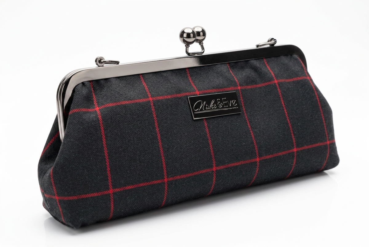 Midnight Regent kisslock clutch by Nola & Eve with detachable chain strap and crimson windowpane detailing
