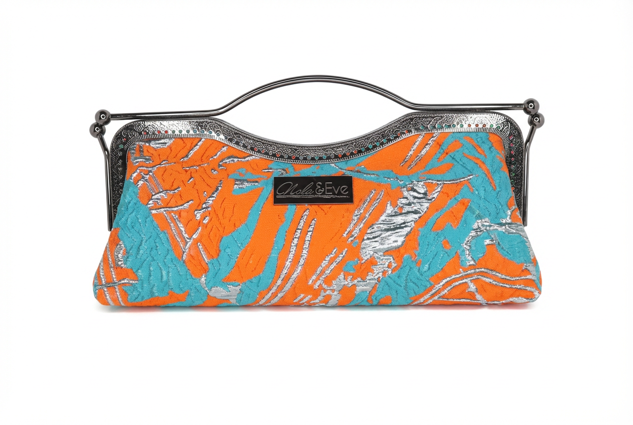 Nola & Eve Desert Mirage Classic statement clutch in richly woven brocade with top handle, satin lined