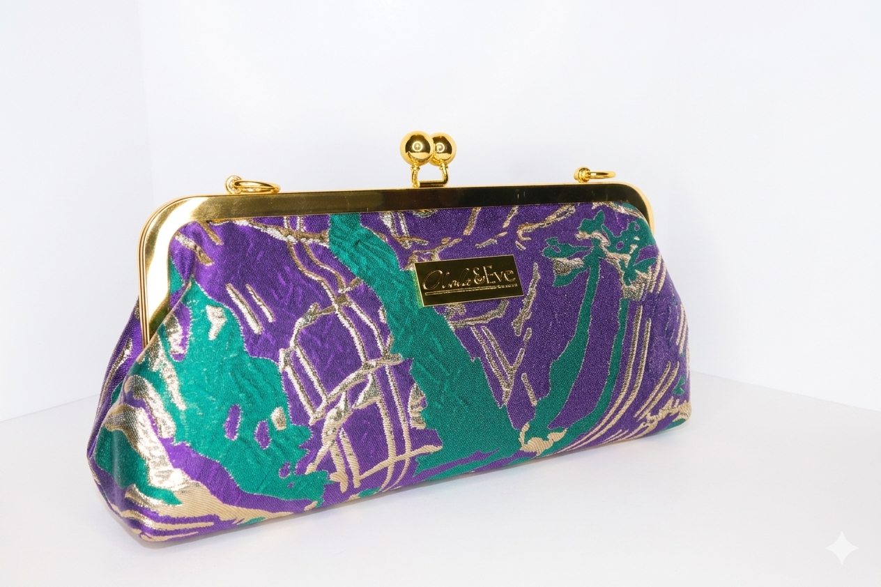 Desert Mirage Classic woven brocade clutch by Nola & Eve with structured frame and detachable chain strap