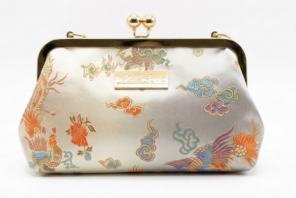 Nola & Eve Phoenix Dynasty Classic handmade brocade clutch with gold ornate frame and phoenix-and-dragon embroidery, limited-edition statement bag