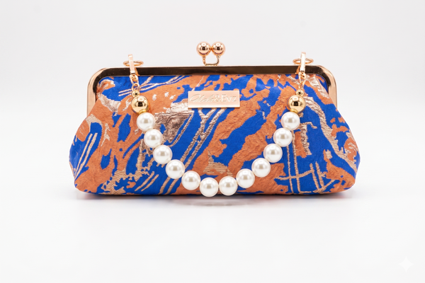 Nola & Eve Desert Mirage Classic handmade brocade clutch with gold kiss-lock frame, limited-edition statement bag