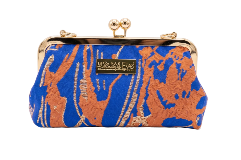 Desert Mirage Classic woven brocade clutch by Nola & Eve with structured frame and detachable chain strap