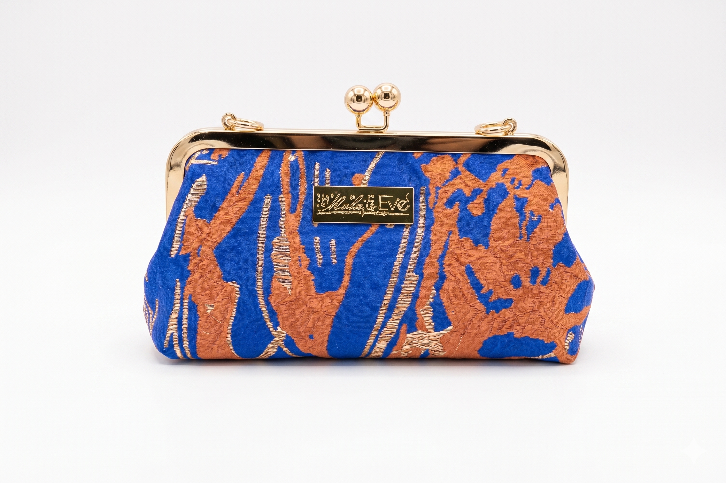 Desert Mirage Classic woven brocade clutch by Nola & Eve with structured frame and detachable chain strap