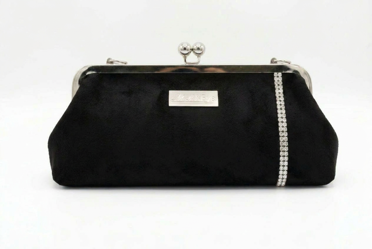 Nola & Eve Suede Radiance clutch in Midnight Black with sleek metallic frame, handmade limited-edition statement bag
