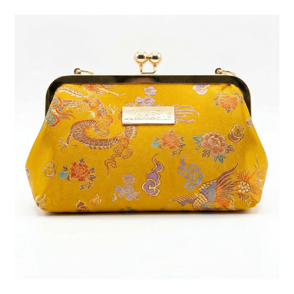 Phoenix Dynasty Classic brocade clutch by Nola & Eve, gold metal frame with top handle and phoenix-and-dragon design