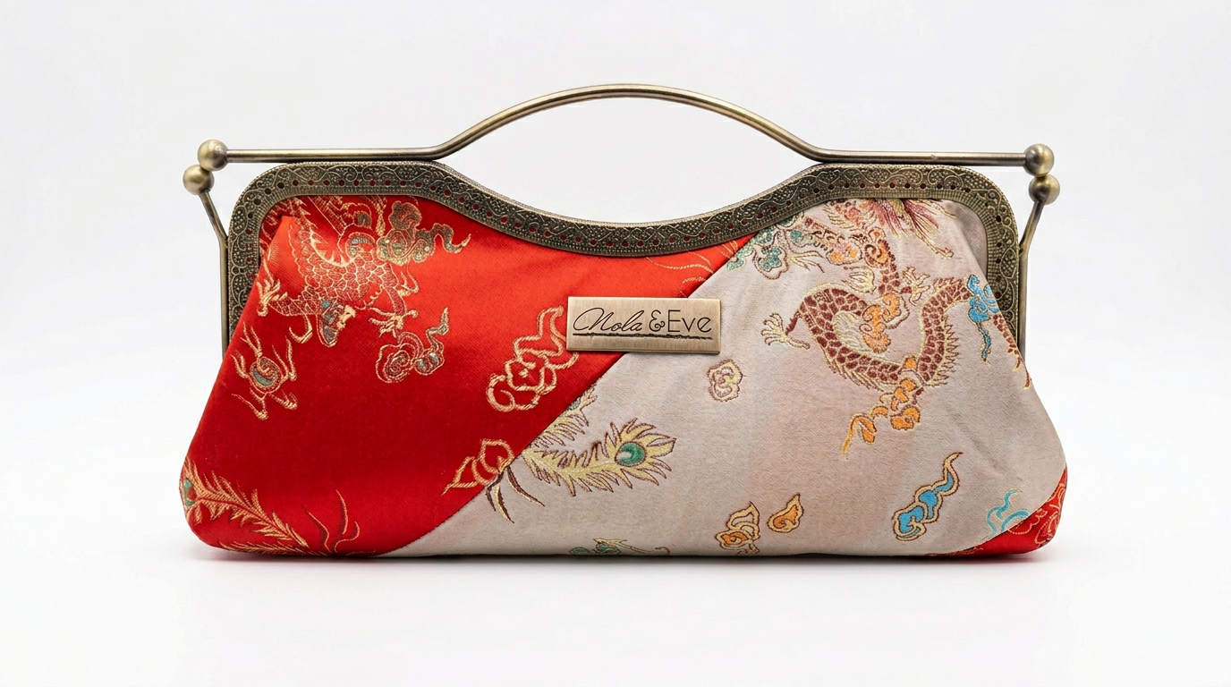 Phoenix Dynasty Signature two-tone brocade clutch by Nola & Eve with dual kiss-lock gold frame