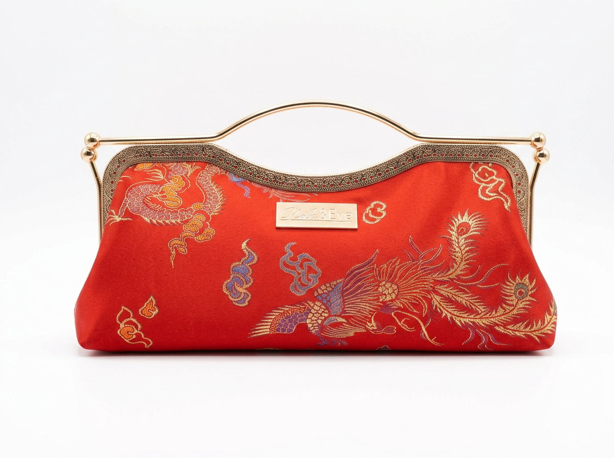 Nola & Eve Phoenix Dynasty Contemporary Classic handmade brocade clutch with gold ornate frame and phoenix-and-dragon embroidery, limited-edition statement bag