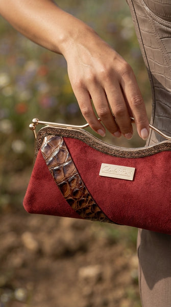 Canyon Belle suede and croc clutch by Nola & Eve with curved top handle and crossbody chain
