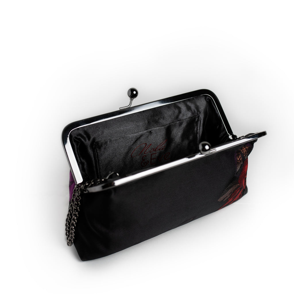 Red and Purple Rose brocade clutch by Nola & Eve with stitched rose motifs and dual chain straps