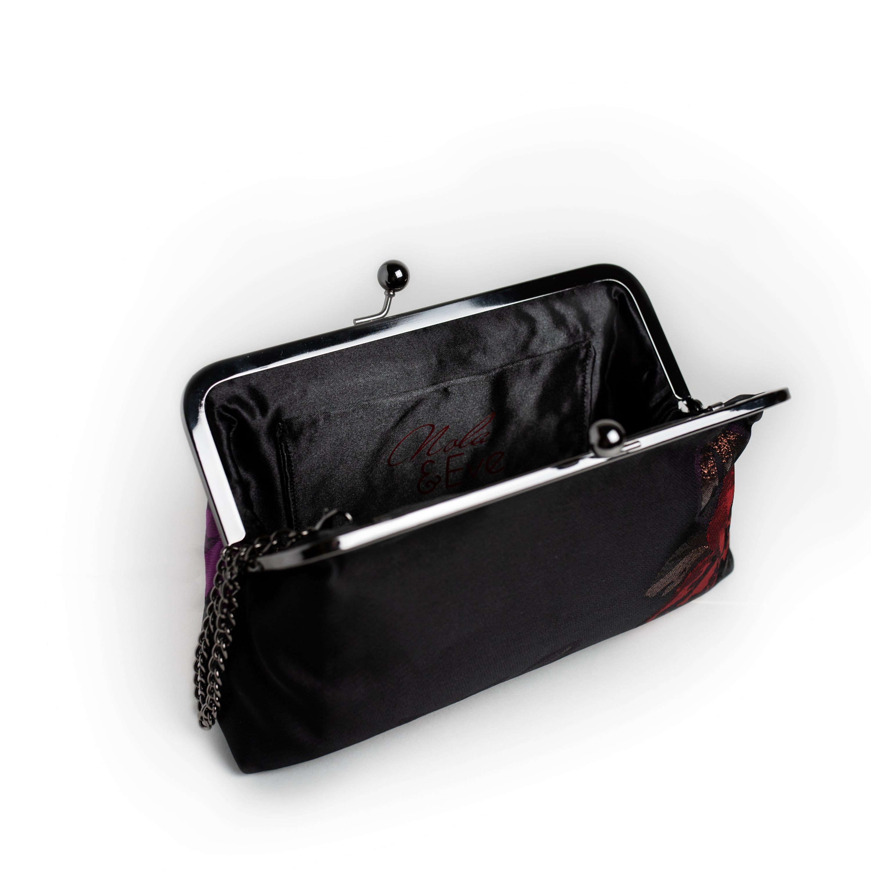 Red and Purple Rose brocade clutch by Nola & Eve with stitched rose motifs and dual chain straps