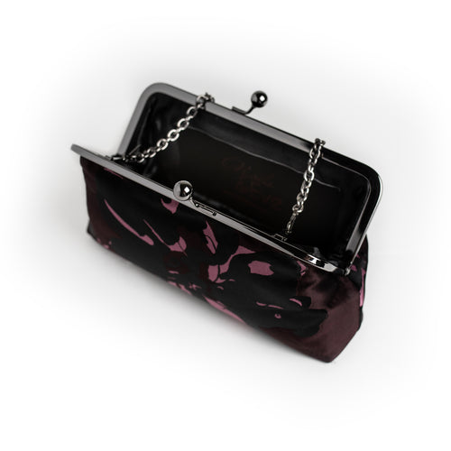 Black and Aubergine dual-tone floral brocade clutch by Nola & Eve with dual chain straps